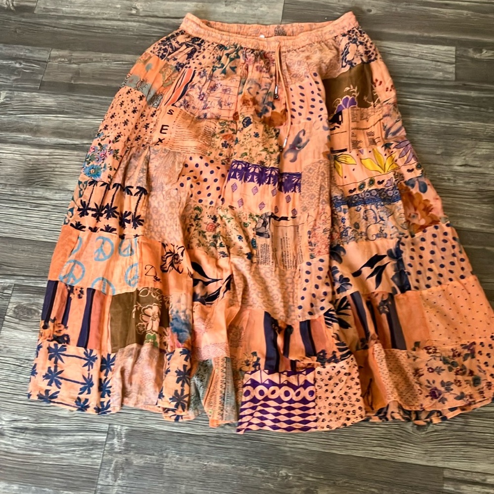 Long orange skirt with multi designs
